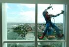 Indonesian “Spider-Man” window cleaner, a 37-year-old named Teguh, works on the 18-storey Alana Hotel on July 12, 2013 in Surabaya, Indonesia. Teguh is a specialist glass window cleaner working on high-rises while wearing the superhero costume and earns between five million rupiah ($520) and 15 million rupiah, depending on building height and the level of difficulty.